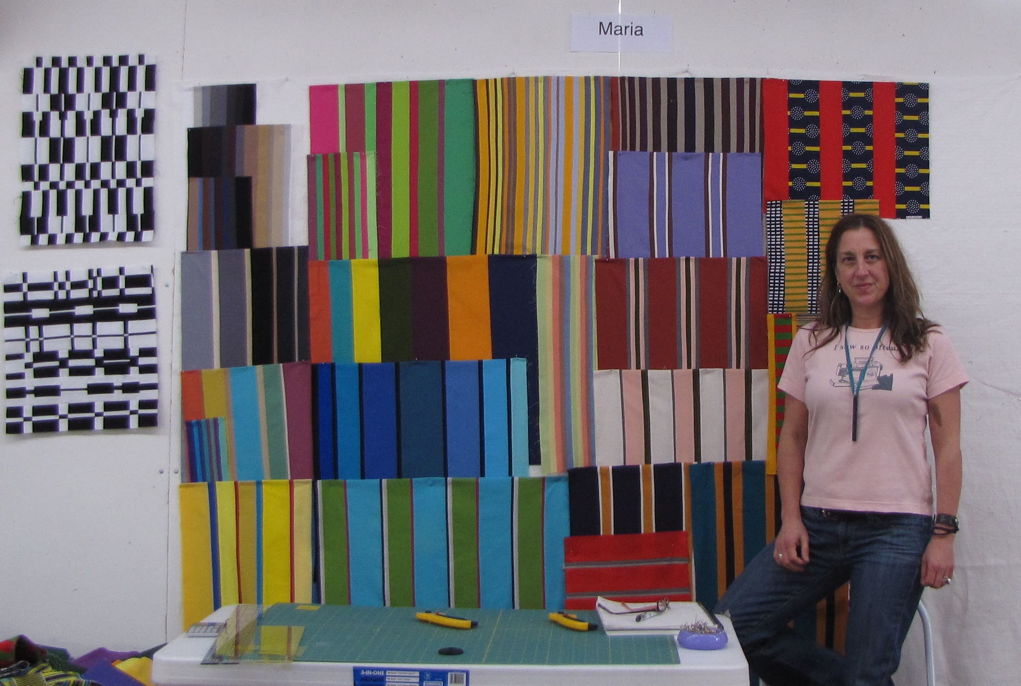 Here I am standing in front of my work. I am wearing one of my favorite t-shirts. I bought it from the Kansas City Arts Institute Book Store. It was silk screened by one of their students. It says I Sew So Often.