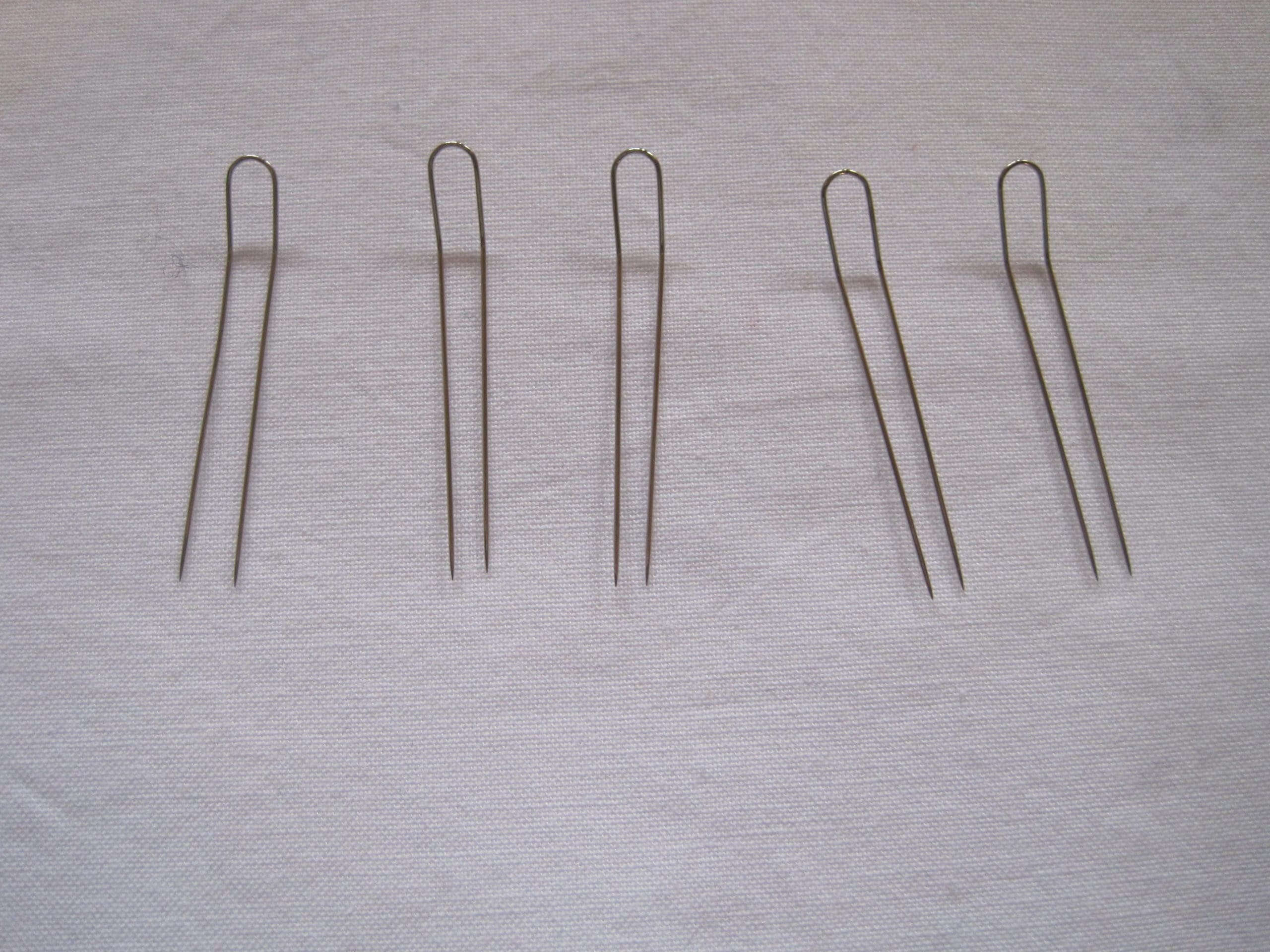 These are the two pronged pins. You can buy them here. Of course, you can make this blanket without them, but it is much easier with them.