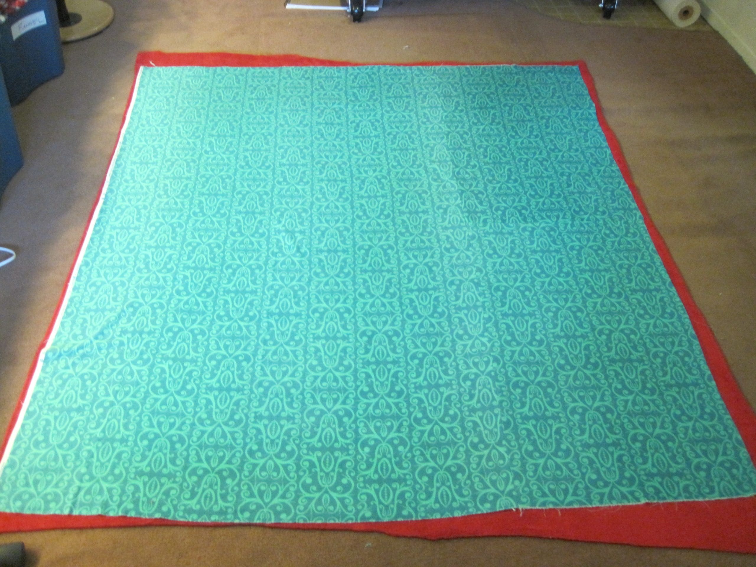 Here the fabric is layed out in my studio. You can see that the Minky is bigger.