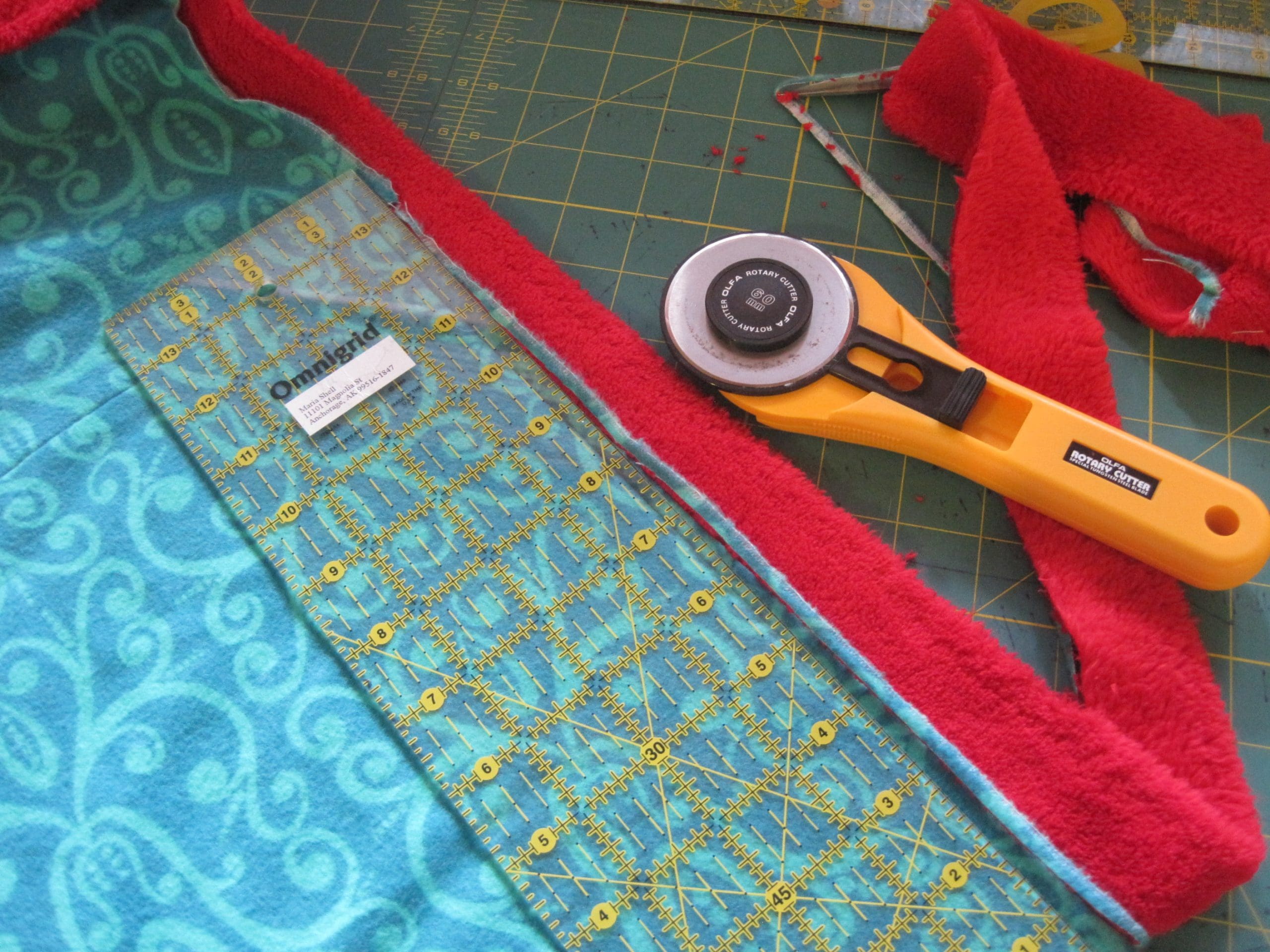 You should trim the edge to be 1/4 of an inch. It can be smaller, but not larger. A larger seam will not fit inside the binding.